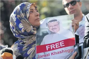  ?? AP ?? Nobel Peace Prize laureate Tawakkol Karman holds a picture of missing Saudi writer Jamal Khashoggi as she speaks to journalist­s near the Saudi Arabian consulate, in Istanbul, Turkey on Friday.