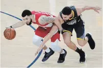  ?? TONY AVELAR THE CANADIAN PRESS FILE PHOTO ?? Toronto guard Fred VanVleet, left, dribbles against Golden State Warriors guard Klay Thompson in Game 6 of the NBA Finals in Oakland last June 13, the night the Raptors won the title.