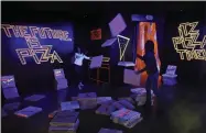  ??  ?? This Nov. 2, 2018photo shows a pizza box playroom created with neon lights and colorful fluorescen­t tape called “Gazoo,” part of a group art exhibition celebratin­g pizza at The Museum of Pizza in New York.