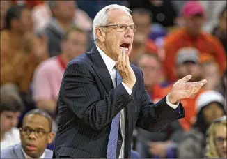  ?? ROBERT WILLETT / NEWS & OBSERVER ?? North Carolina men’s basketball coach Roy Williams will not have to worry about NCAA sanctions after the body said it would not punish the school for academic fraud.