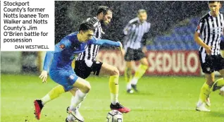  ?? DAN WESTWELL ?? Stockport County’s former Notts loanee Tom Walker and Notts County’s Jim O’brien battle for possession