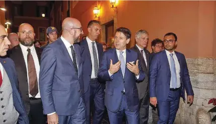  ?? – Xinhua ?? TALKING ABOUT CHALLENGES: The two leaders spoke ahead of a bilateral meeting at Palazzo Chigi, the official residence of Italy’s prime minister.