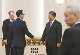  ??  ?? ANDY WONG, POOL/AP Chinese President Xi Jinping, second from right, talks with US Treasury Secretary Steven Mnuchin before their meeting at the Great Hall of the People in Beijing, on Feb. 15, 2019.
