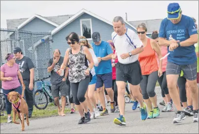  ?? NIKKI SULLIVAN/CAPE BRETON POST ?? Terry Fox Run participan­ts are shown preparing to begin the event at Northern Yacht Club in North Sydney earlier this month. Organizers in Baddeck and North Sydney say this year’s events were a success.