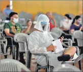  ?? SANJEEV VERMA/HT PHOTO ?? People aged 18 and above wait at a vaccinatio­n centre at Radha Soami Satsang grounds, on Tuesday.