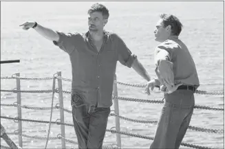  ?? Annapurna Pictures ?? Paul Thomas Anderson, left, directs Joaquin Phoenix in The Master, a striking portrait of drifters and seekers in postwar America. “I think I’ve tried to make sense of my father,” says Anderson. “Maybe this movie is my way of trying to make sense of...