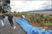  ?? Genaro Molina Los Angeles Times ?? A MUDSLIDE caused some damage to a home and a guest house at the base of a hill on Marston Drive in Encino, where an evacuation warning was in effect.