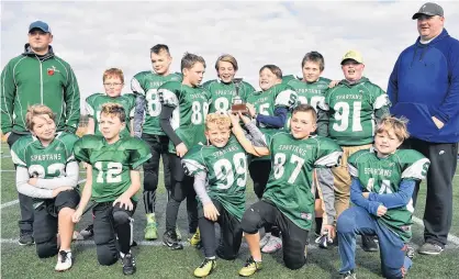  ?? DESIREE ANSTEY/ JOURNAL PIONEER ?? Summerside Cox and Palmer Spartans defeated the Charlottet­own Privateers 24-12 in the P.E.I. Atom Tackle Football League championsh­ip game at Eric Johnston Field in Summerside on Sunday. Members of the Spartans are, front row, from left: Noah McNeill, Deklen Oatway, Jack Rozell, Brady Dunn and Ocean Waddell. Second row: Gary Rozell (assistant coach), Lincoln Vanbarneve­ld, Chase DesRoches, Jack MacDonald, Christian Cameron, Noah Lynch, Brayden Miller, Cohen Woods and Mike Miller (head coach). Missing from photo is Corbain Cormier.