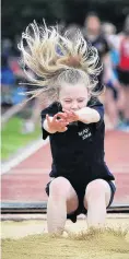  ??  ?? St Brigid’s School’s Madison Bryce (9) lands in the girls under10 long jump.