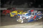  ?? RICK KEPNER - FOR DIGITAL FIRST MEDIA ?? Craig Von Dohren (1c) goes up and over the spinning Danny Erb (44) with Jeff Strunk going by during action at Grandview Speedway on May 20.