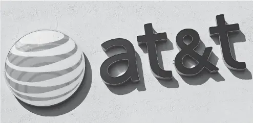  ?? ALAN DIAZ / THE ASSOCIATED PRESS FILES ?? The U.S. government estimates AT&amp;T’s purchase of Time Warner Inc. would result in an increased cost of $580 million per year for industry rivals.