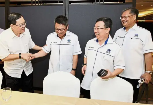  ??  ?? Help for house buyers: (From left) Lim with Rehda’s Toh, Tan Hun Beng and Datuk Jerry Chan sharing a light moment after the press conference at Setia SPICE Convention Centre, Penang.