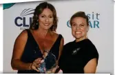  ?? ?? MegAn Catterall from itravel receives the Mobile/Home-Based Agent of the Year - Australia award from Regent Seven Seas Cruises’ Elsa McLean.