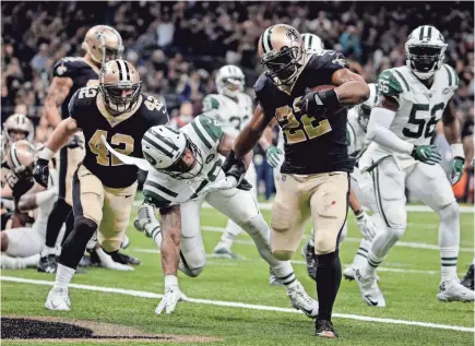  ??  ?? Saints running back Mark Ingram scores one of the team’s 23 rushing TDs. DERICK E. HINGLE/USA TODAY SPORTS