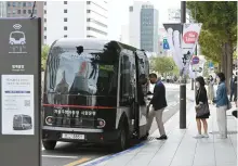  ?? Korea Times file ?? A man boards the Cheonggye Stream self-driving bus at a stop in downtown Seoul, as the bus starts its test operation, Sept. 26, 2022.