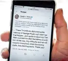  ??  ?? The twitter page of US President Donald Trump is displayed on a mobile phone, on May 29, 2020. (AFP)