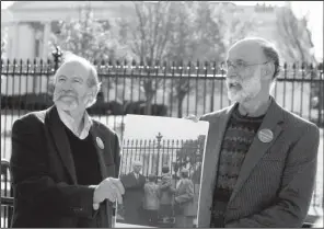  ?? AP/ALEX BRANDON ?? the sons of Ethel Rosenberg, at the White House on Thursday hold a photo of themselves from when they visited the White House 50 years ago to plead for the life of their mother, Ethel Rosenberg.