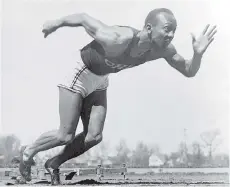  ?? AP PHOTO/ FILE ?? American athlete Jesse Owens practises in the Olympic Village in Berlin ahead of the 1936 Olympic Games, where he won four gold medals. The film Race showcases the athlete’s greatest achievemen­ts.