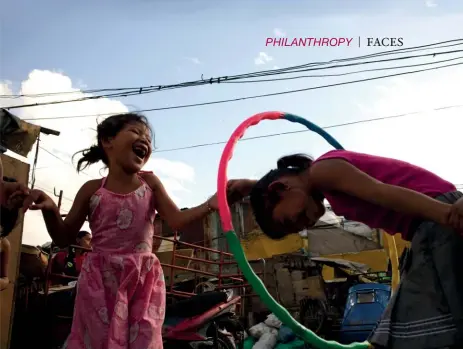  ??  ?? SIMPLE JOYS Life may be hard, but the children living in the Tondo slum area in Manila have found ways to learn, laugh and play as intensely as any other kids in this image by Singapore photojourn­alist Mathias Heng