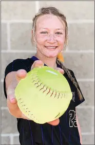  ?? Contribute­d photo ?? Big bat: Allie Thurmon shows off a home run ball from this season. The junior catcher is batting .500 for the Lady Dragons this season.