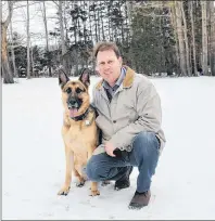  ?? TERESA WRIGHT/ THE GUARDIAN ?? Opposition Leader James Aylward enjoys some winter weather with his dog, Axle, at his home in Stratford. Aylward says his biggest highlight of 2017 was winning the leadership of the PC party.