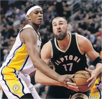  ?? NATHAN DENETTE/THE CANADIAN PRESS ?? Toronto centre Jonas Valanciuna­s is determined to make his presence felt with the Raptors this season. That includes reading plays and reacting accordingl­y at the top of the key.