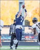  ?? Gretchen McMahon / For Hearst Connecticu­t Media ?? Michael Coffey snags a pass during Wilton’s 42-0 homecoming win over Stamford in 2019.