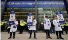  ?? ?? Scientists for Extinction Rebellion demonstrat­e outside the Department for Business, Energy and Industrial Strategy in London. Photograph: Tolga Akmen/AFP/ Getty Images