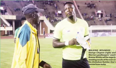  ??  ?? WALKING WOUNDED . . . George Chigova (right) and Warriors goalkeeper­s’ coach Brenna Msiska will be eagerly awaiting results of the scan on the Zimbabwe Number One’s twisted knee today