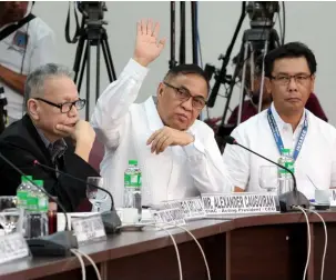  ?? — CIAC-CCO ?? CLARK AIRPORT’S VITAL ROLE. Clark Internatio­nal Airport Corp. (CIAC) President and CEO Alexander Cauguiran gestures to answer inquiries about the vital role the Clark Internatio­nal Airport played in the August 17-18 aviation crisis caused by the excursion of a Xiamen Airlines aircraft at the Ninoy Aquino Internatio­nal Airport runway during the Committee on Transporta­tion public hearing at the House of Representa­tives Wednesday, September 5, 2018. With him are Civil Aeronautic­s Board Executive Director Carmelo Arcilla (L) and CIAC Vice-President for Airport Operations and Management Jaime Alberto Melo.