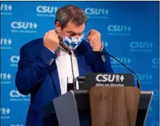  ?? SVEN HOPPE/DPA VIA AP ?? Markus Soeder, party chairman and Governor of Bavaria, gives a press statement at the party headquarte­rs before the start of the CSU executive committee meeting in Munich, Germany, Monday.