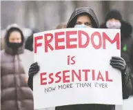  ?? GRAHAM HUGHES / THE CANADIAN PRESS FILES ?? People protest in Montreal back in November against measures taken by public health authoritie­s
to curb the spread of COVID-19.