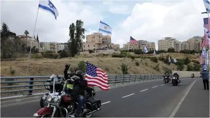  ??  ?? A BIKER rides near the new site of the US Embassy in Jerusalem.