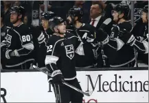  ?? SEAN M. HAFFEY — GETTY IMAGES ?? Kevin Fiala of the Kings is congratula­ted after scoring during the first period against the Wild on Wednesday night at Crypto.com Arena.