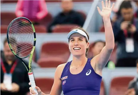  ??  ?? Johanna Konta waves to spectators after defeating Madison Keys in the semi-finals of the China Open yesterday. The win made her the first British women to reach the top 10 ranking in 32 years. — AP