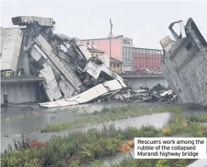  ??  ?? Rescuers work among the rubble of the collapsed Morandi highway bridge