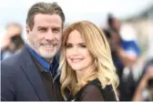  ?? ANNE-CHRISTINE POUJOULAT/AFP/GETTY IMAGES ?? John Travolta and wife Kelly Preston pose during a photocall for the film “Gotti” at the Cannes Film Festival in Cannes, southern France, in May 2018.