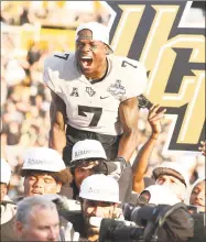  ?? Stephen M. Dowell / Orlando Sentinel ?? UCF’s Emmanuel Logan-Greene celebrates after winning the American Athletic Conference Championsh­ip game against Memphis on Saturday.