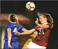  ?? NWA Democrat-Gazette file photo/MICHAEL WOODS ?? Kayla Mckeon (24) of Arkansas goes up for the header in front of Duke defender Ashton Miller on Aug. 26 at Razorback field in Fayettevil­le.