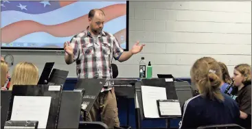  ?? Spencer Lahr / Rome News-Tribune ?? Armuchee High band teacher Seth Bates directs students on Tuesday. While the band room has been talked about as a potential target of ELOST improvemen­ts, nothing definitive has been set for what modernizat­ion would mean for the band.