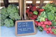  ??  ?? Various vegetables are offered for sale at Wellspring Farm.