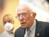  ?? DREW ANGERER/GETTY ?? Sen. Bernie Sanders, I-Vt., speaks to reporters outside the office of Senate Majority Leader Chuck Schumer, D-N.Y., at the U.S. Capitol in Washington on Thursday.