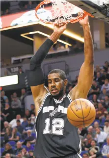  ?? Jim Mone / Associated Press ?? LaMarcus Aldridge dunks in the first half for two of his 26 points for San Antonio. He also had five rebounds.