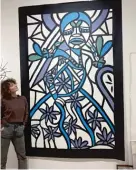  ?? ?? Artist ZorZorZor in front of a painting she recently completed based on a South Loop mural she created in 2016.