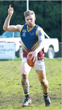  ??  ?? Warragul Industrial­s player Ben Northover kicks from defence during the match against Ellinbank