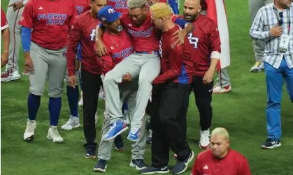  ?? ?? Edwin Diaz is helped off the field after being injured during on-field celebratio­ns. Photograph: Eric Espada/Getty Images