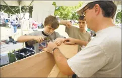  ?? Mystic Seaport Museum / Contribute­d photo ?? Family Boat Building is one of the more popular events.