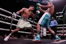  ?? Photograph: Adam Hunger/ Getty Images ?? Danny Garcia, left, landed nearly twice as many punches as José Benavidez Jr during their super welterweig­ht fight on Saturday night.