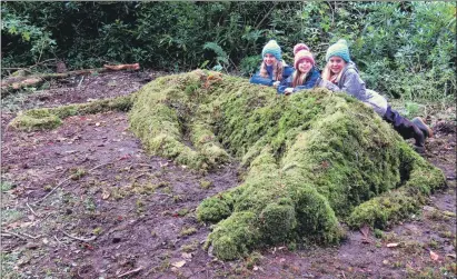  ??  ?? Edie, Jessica and Alex helped to build Bran, the turf dog, at Dunollie.