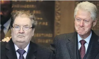  ??  ?? John Hume at the Guildhall in Londonderr­y, Northern Ireland, with former U.S. president Bill Clinton. Hume won the Nobel Peace Prize for work to end violence in Northern Ireland.